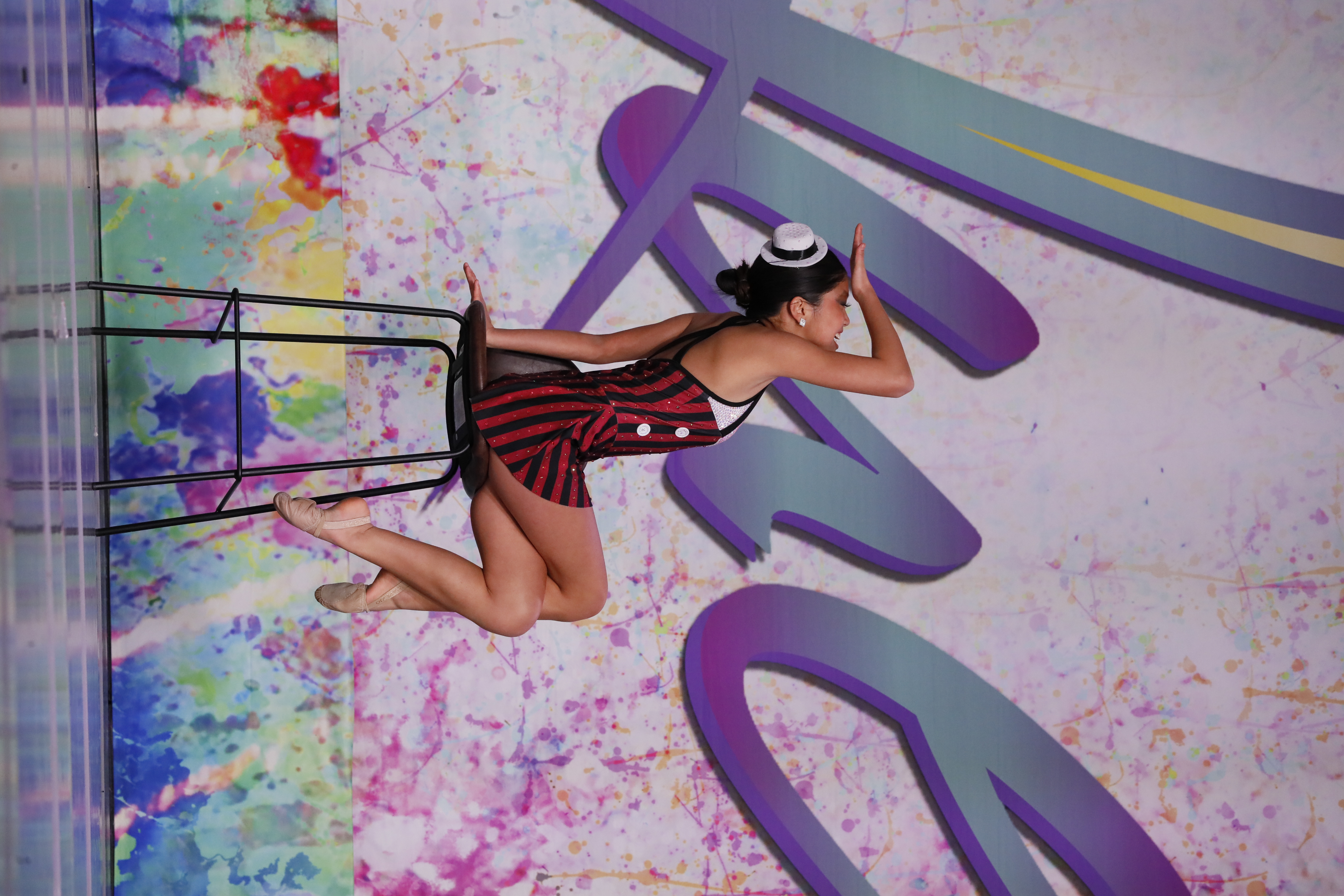 Evelyn performing on stage at a national dance competition